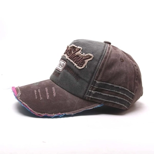 Detail of vintage baseball cap featuring distressed brim with 1969 embroidery