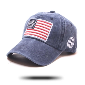 Detail of navy washed cotton baseball cap with USA flag patch and side embroidery
