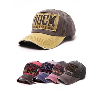 Detail showing distressed cotton fabric and 3D ROCK embroidery on washed baseball cap
