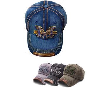 Detail of vintage washed denim baseball caps with 3D letter M embroidery and leather brim trim