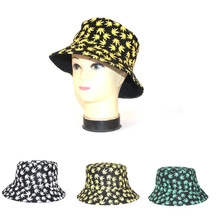 Flat lay showing three colors of clover print canvas bucket hats with reversible design