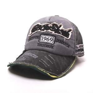 Detailed view of the 1969 patch embroidery and distressed fabric on a baseball cap