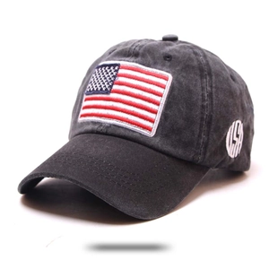 Detail of vintage washed black cotton baseball cap with embroidered American flag patch