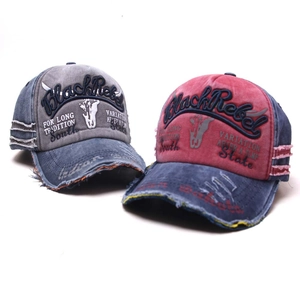 Close-up of vintage washed cotton baseball caps with 3D embroidery and worn-out details