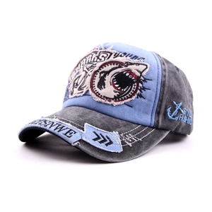 Detailed embroidery of a Great White Shark and distressed denim texture on a baseball cap