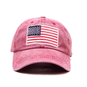Close-up of USA flag embroidery and vintage washed texture on burgundy baseball cap