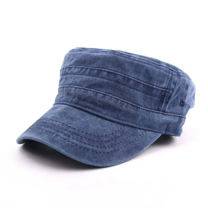 Detail of washed denim military cap featuring metal side eyelets and neat stitching