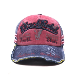 Detail of 3D embroidered Black Rebel text on washed vintage cotton baseball cap with frayed brim