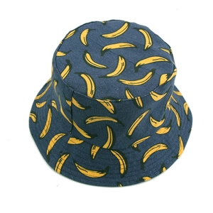Reversible bucket hat with yellow banana pattern on navy blue canvas fabric for sun protection