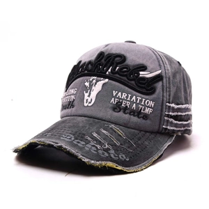 Close-up of vintage washed cotton baseball cap with 3D embroidery and distressed brim details