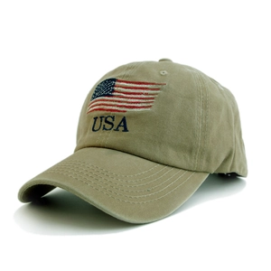 Detail of embroidered USA text and American flag on washed khaki baseball cap