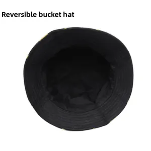 Detail view of the reversible black cotton bucket hat with parallel stitching on the brim