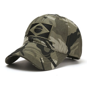 Detail of camouflage baseball cap featuring a Brazilian flag patch and cotton twill texture