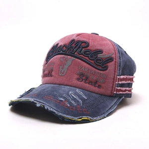Detail of distressed washed cotton baseball cap with Black Rebel 3D embroidery
