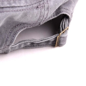 Close-up of gray washed cotton cadet cap with adjustable metal buckle and back strap