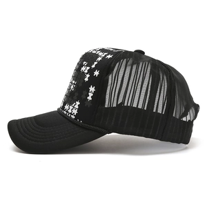 Classic black and white trucker hat with puzzle pattern and breathable mesh back