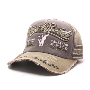 Close-up of Black Rebel 3D embroidery and distressed details on a vintage baseball cap