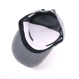 Detail of washed cotton flat top military cap with metal buckle and inner sweatband