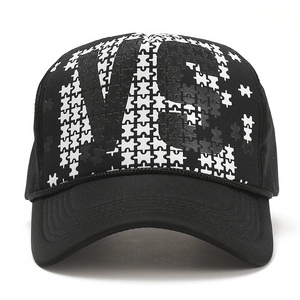 Unisex black and white mesh trucker hat with puzzle print and bold V graphic logo
