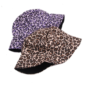 Detail view of purple and brown leopard print bucket hats with flat top design