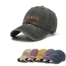 Detail showing various colors of washed cotton baseball caps with CHANCE embroidery