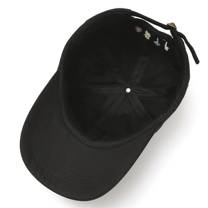 Detailed view of the black baseball cap interior with reinforced seams and metal buckle