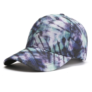 Detail view of colorful tie-dye patterns and high-quality cotton twill texture on a baseball cap