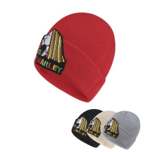 Detailed view of Bob Marley knitted beanies in red, black, beige, and grey colors