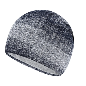 Versatile knitted beanie in navy blue and white blend with a soft warm lining