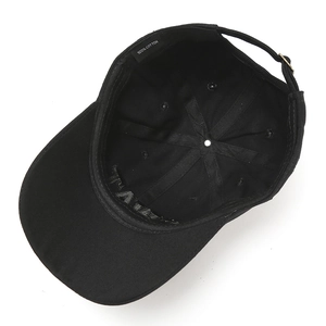 Detail of 100% cotton interior with reinforced seams and adjustable metal buckle on black cap