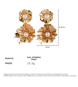 Detail view of gold flower earrings with pearls showing dimensions 6.5cm by 4cm