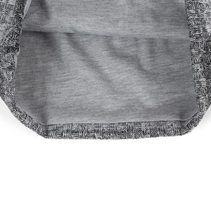 Detail shot of the grey knit slouchy beanie showing smooth inner lining and neat stitching