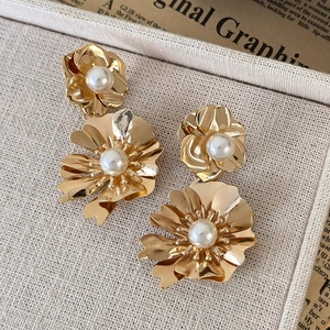 French vintage style gold double-layer metal flower earrings with pearls on display