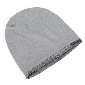 Detail shot of the dual-layer grey beanie showing soft knit texture and ribbed inner lining