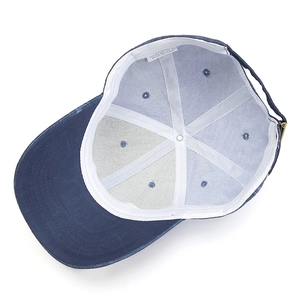 Macro shot of 100% cotton baseball cap interior with sweatband and wash label
