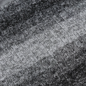 Detail shot of the ribbed knit fabric in grey melange showing texture and stitching