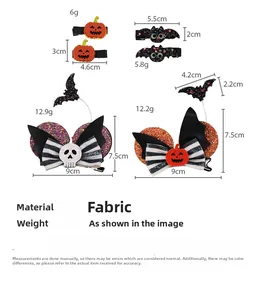 Detailed view of Halloween hair clips featuring pumpkin, bat, and skull glitter designs