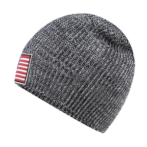 Detail of heather grey knit beanie with American flag embroidery patch on the side