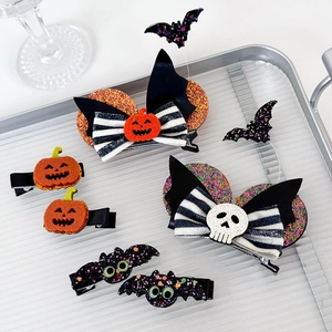 Halloween hair clip set featuring pumpkin, bat and glitter bow designs for parties