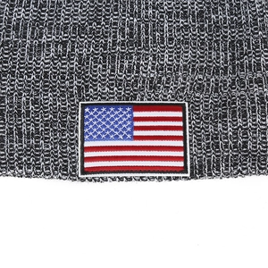 Detailed view of knitted beanie with USA flag embroidery patch and texture