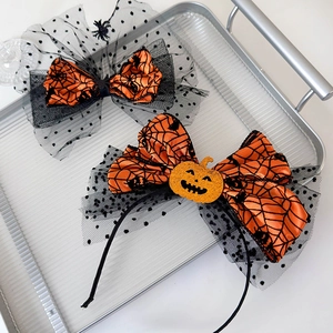 Halloween pumpkin headband and spider bow hair clip set with orange spiderweb patterns