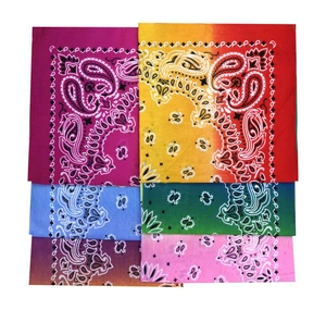 Close-up of assorted paisley bandanas in vibrant gradient colors with classic patterns