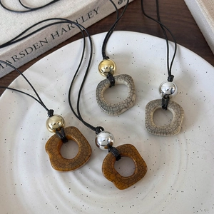 Artistic vintage camel bone style ceramic pendant necklaces in various crackle glaze finishes