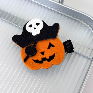 Detail view of pirate pumpkin hair clip with felt material and metal duckbill clip