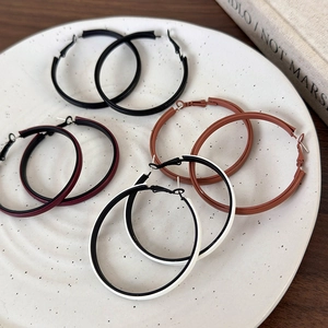 Set of four minimalist large hoop earrings in brown, black, burgundy and white leather finish
