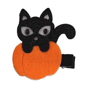 Detail of Halloween hair clip with glitter black cat and orange felt pumpkin on ribbon clip