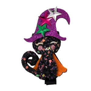 Close-up of Halloween hair clip featuring a black cat in wizard hat with glitter sequins