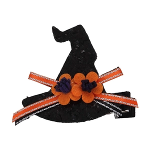 Detail of Halloween witch hat hair clip with black sequins and orange ribbon accents