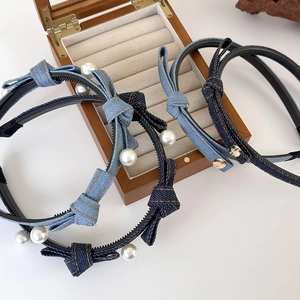 Denim bow headband with pearls in light and dark blue shades for a stylish hair look