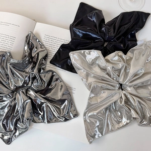Metallic bow scrunchie set in silver, gunmetal, and black with shiny pleated texture